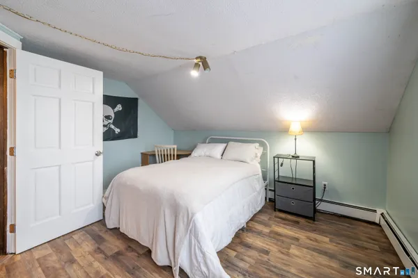 a bedroom with a bed and a closet