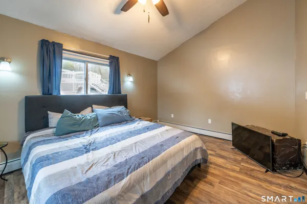 a bedroom with a bed and window