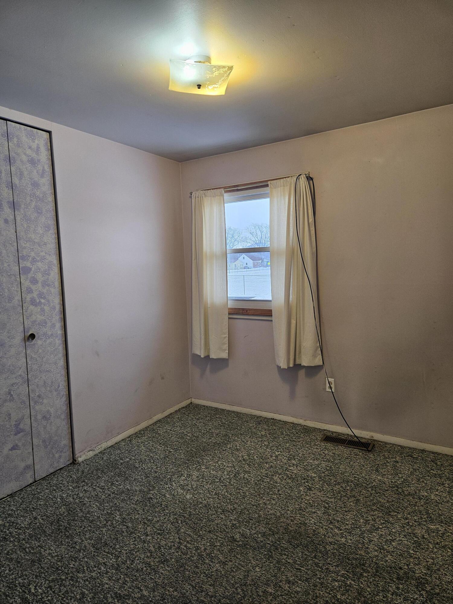 309 Redpath Avenue Michigan City, IN 46360 - Photo 13 of 27 an empty room with windows