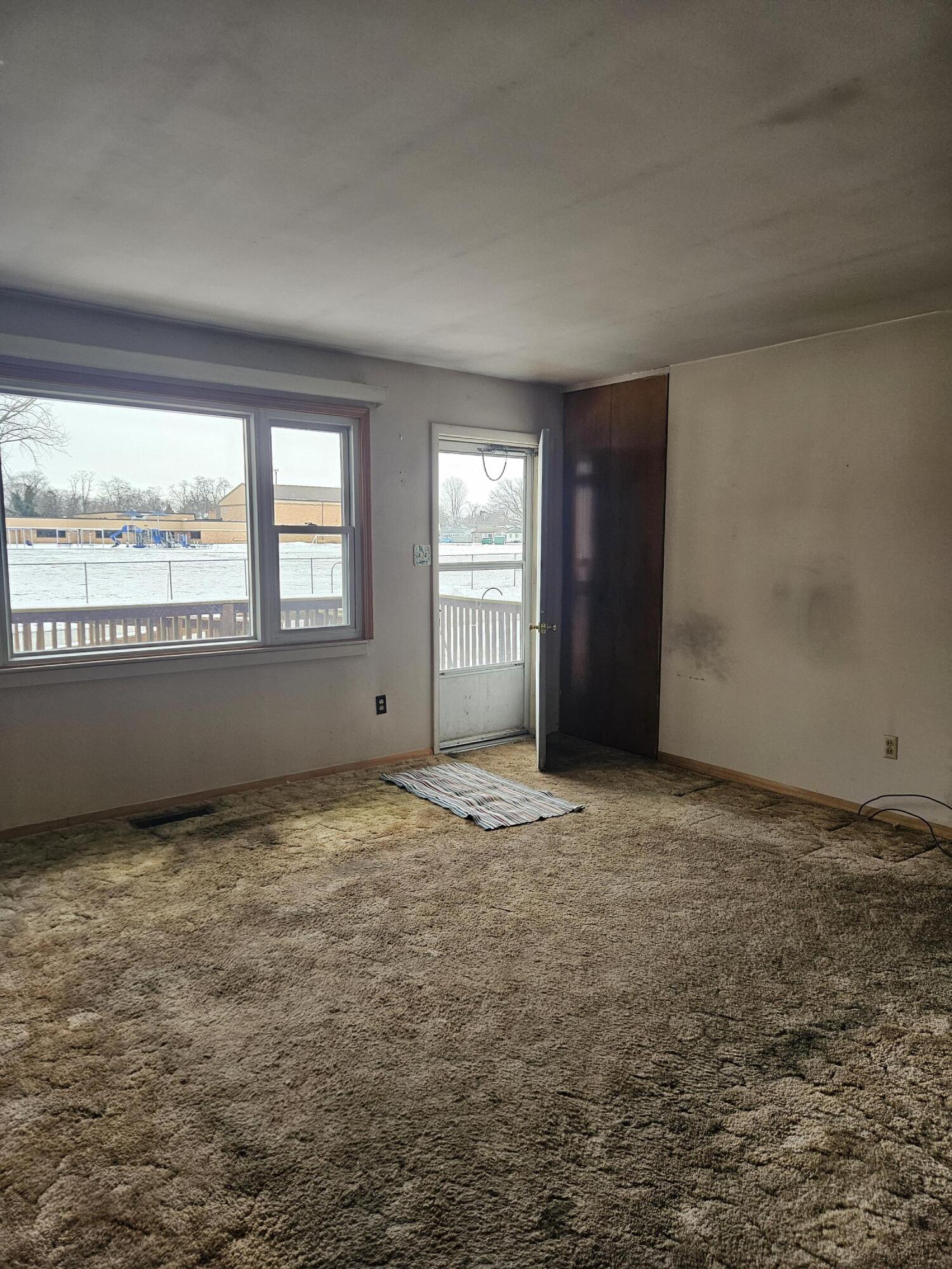 309 Redpath Avenue Michigan City, IN 46360 - Photo 5 of 27 a view of an empty room and window