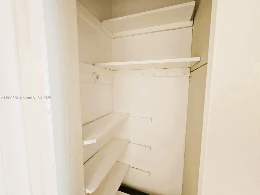 3217 Northeast 7th Place, Unit 1 Pompano Beach, FL 33062 - Photo 14 of 28 a view of walk in closet