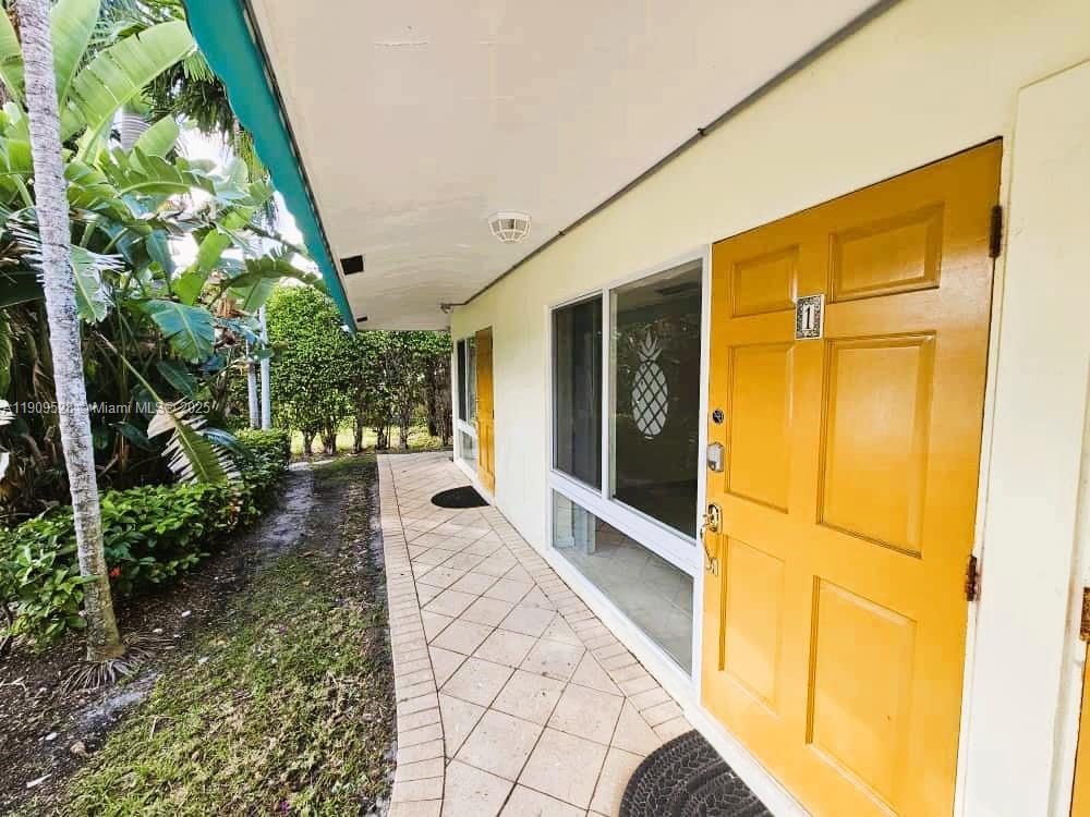 3217 Northeast 7th Place, Unit 1 Pompano Beach, FL 33062 - Photo 28 of 28 a view of entrance gate of the house
