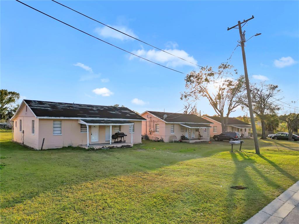 301 Southwest 3rd Terrace Mulberry, FL 33860 - Photo 11 of 39 a view of a house with a big yard and potted plants
