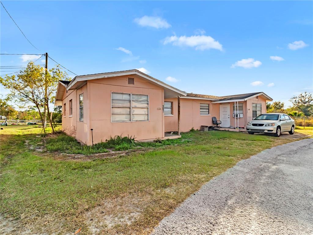 301 Southwest 3rd Terrace Mulberry, FL 33860 - Photo 13 of 39 a front view of a house with a garden