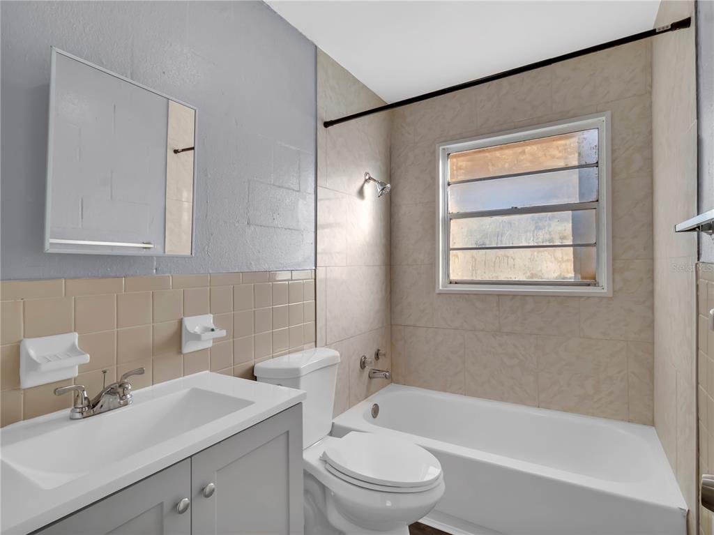 301 Southwest 3rd Terrace Mulberry, FL 33860 - Photo 21 of 39 a bathroom with a sink toilet and shower