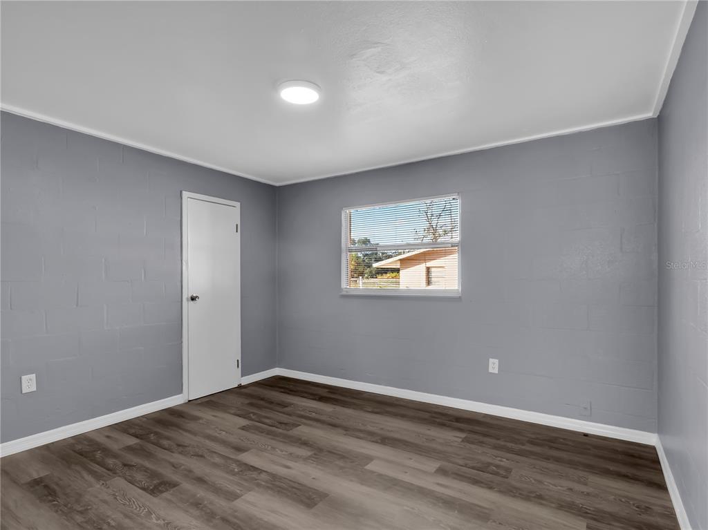 301 Southwest 3rd Terrace Mulberry, FL 33860 - Photo 24 of 39 a view of empty room with wooden floor