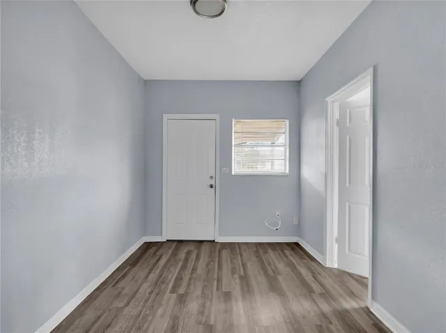 a kitchen with cabinets appliances a sink and a window