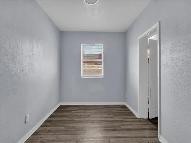a white toilet sitting next to a bath tub