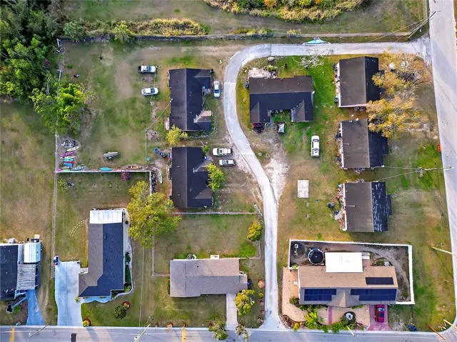 an aerial view of house with yard swimming pool and outdoor seating