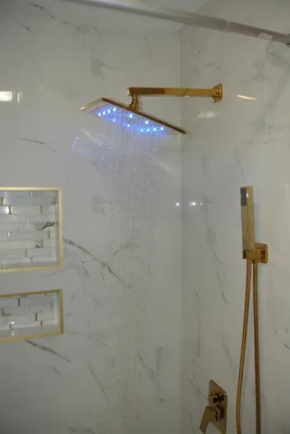a bathroom with a shower and a sink