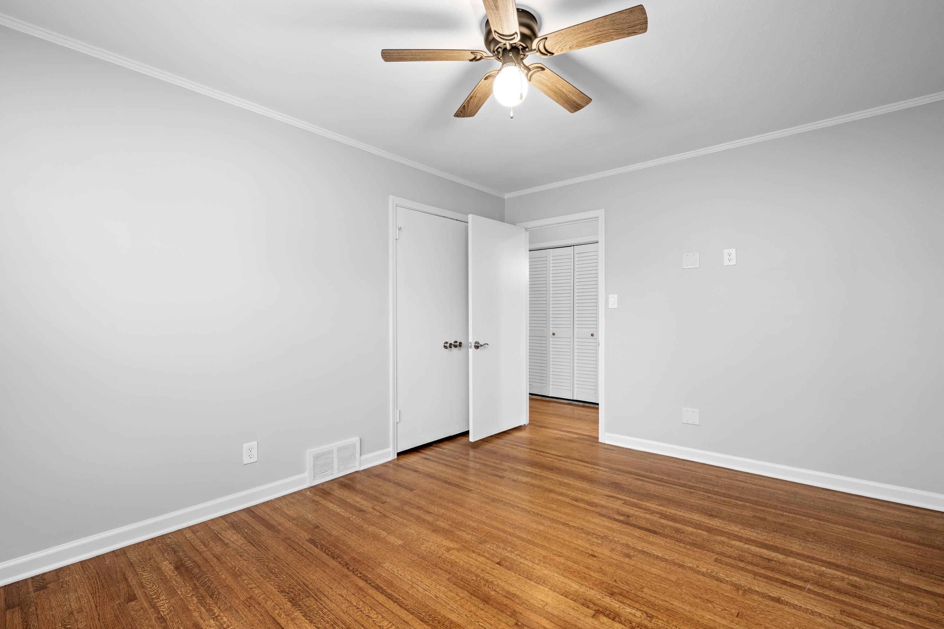 1453 Colonial Road Memphis, TN 38117 - Photo 19 of 36 a view of an empty room with wooden floor