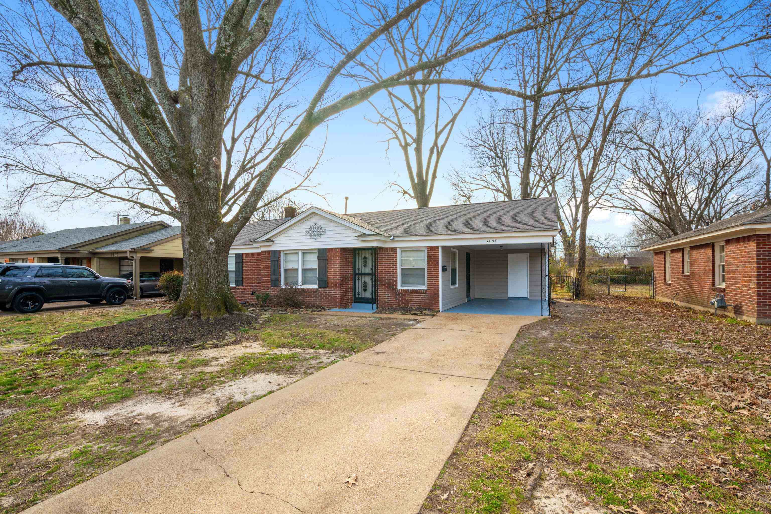 1453 Colonial Road Memphis, TN 38117 - Photo 26 of 36 a front view of a house with a yard