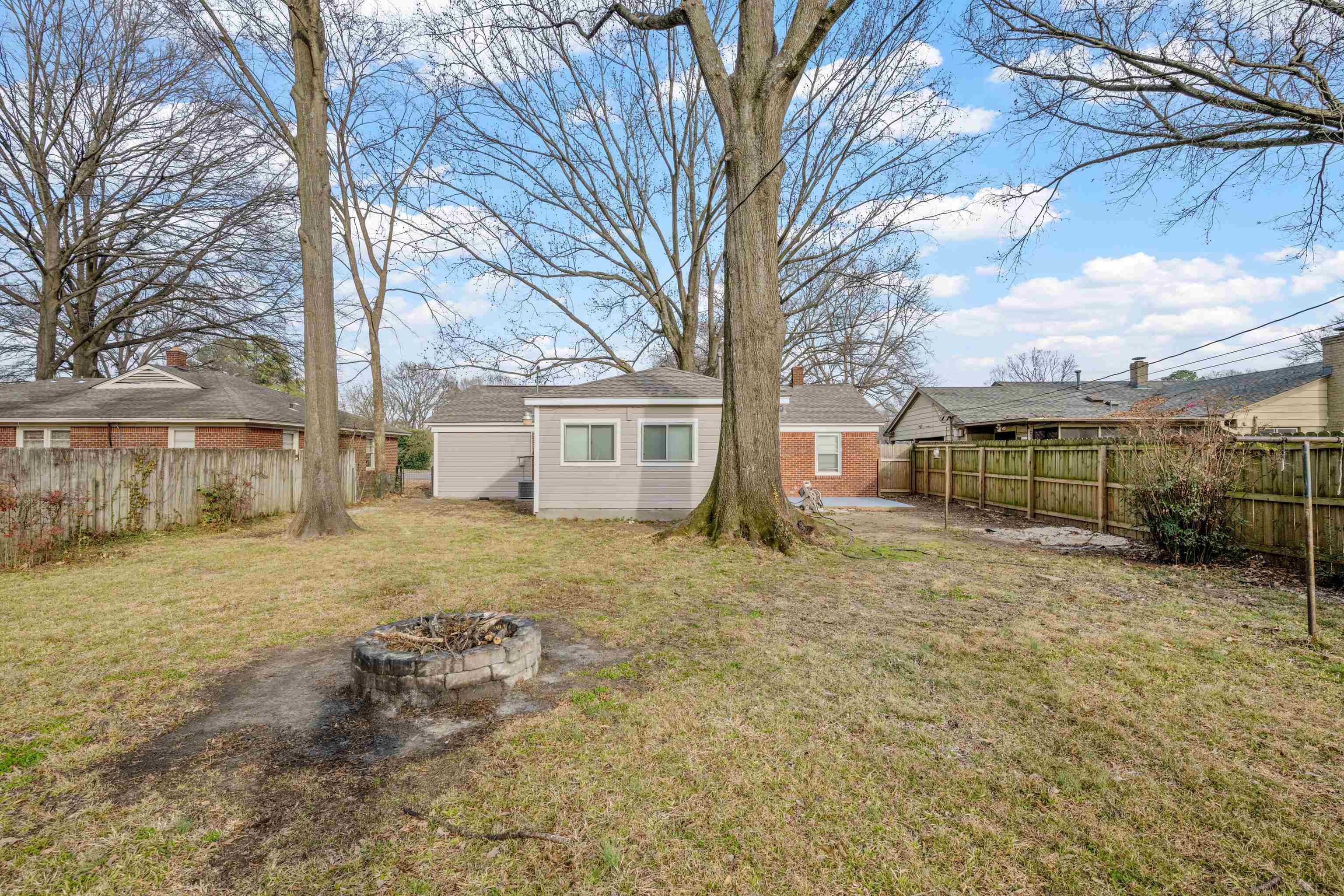 1453 Colonial Road Memphis, TN 38117 - Photo 31 of 36 a view of a yard in front of a house with a large tree