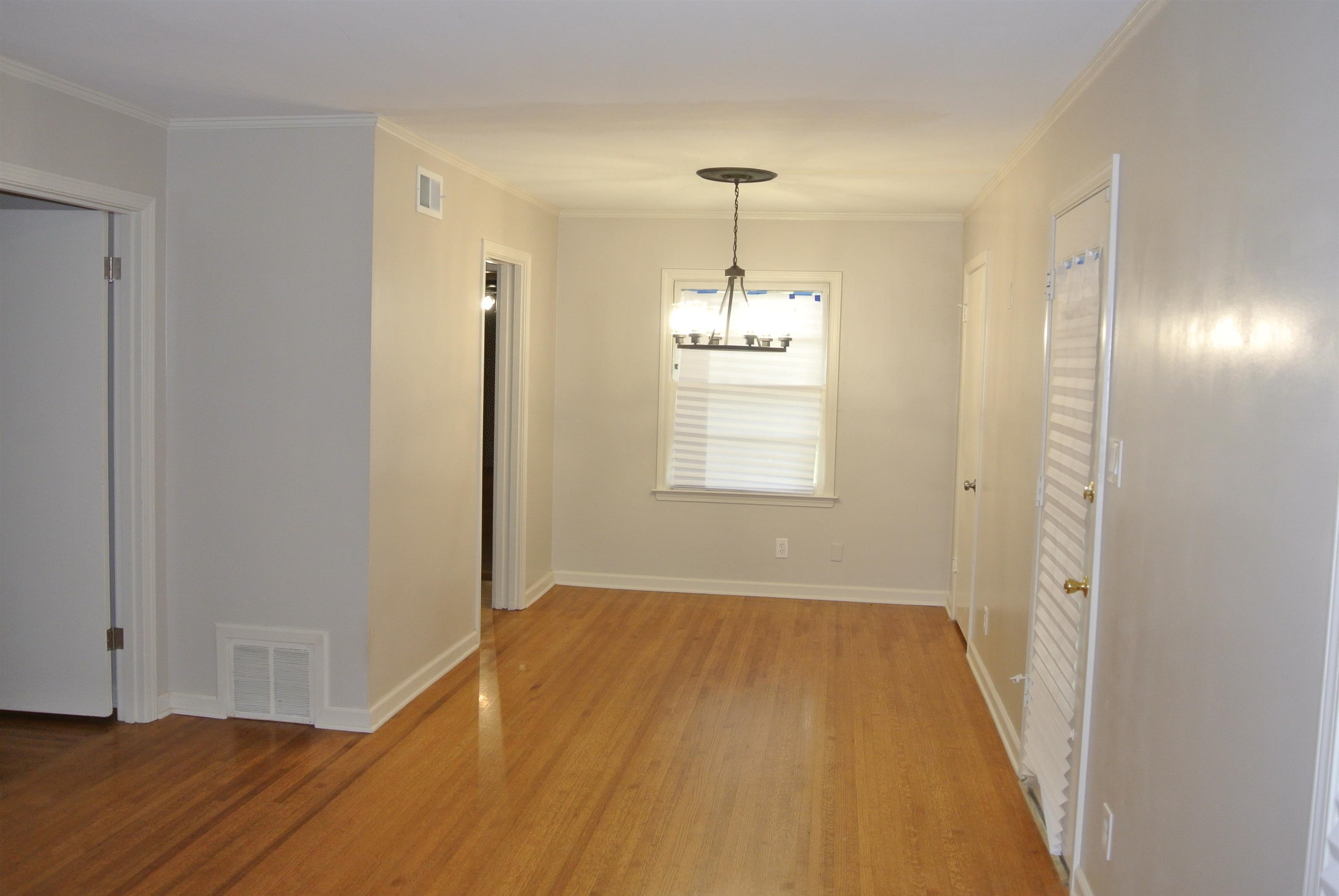 1453 Colonial Road Memphis, TN 38117 - Photo 4 of 19 a view of empty room with wooden floor