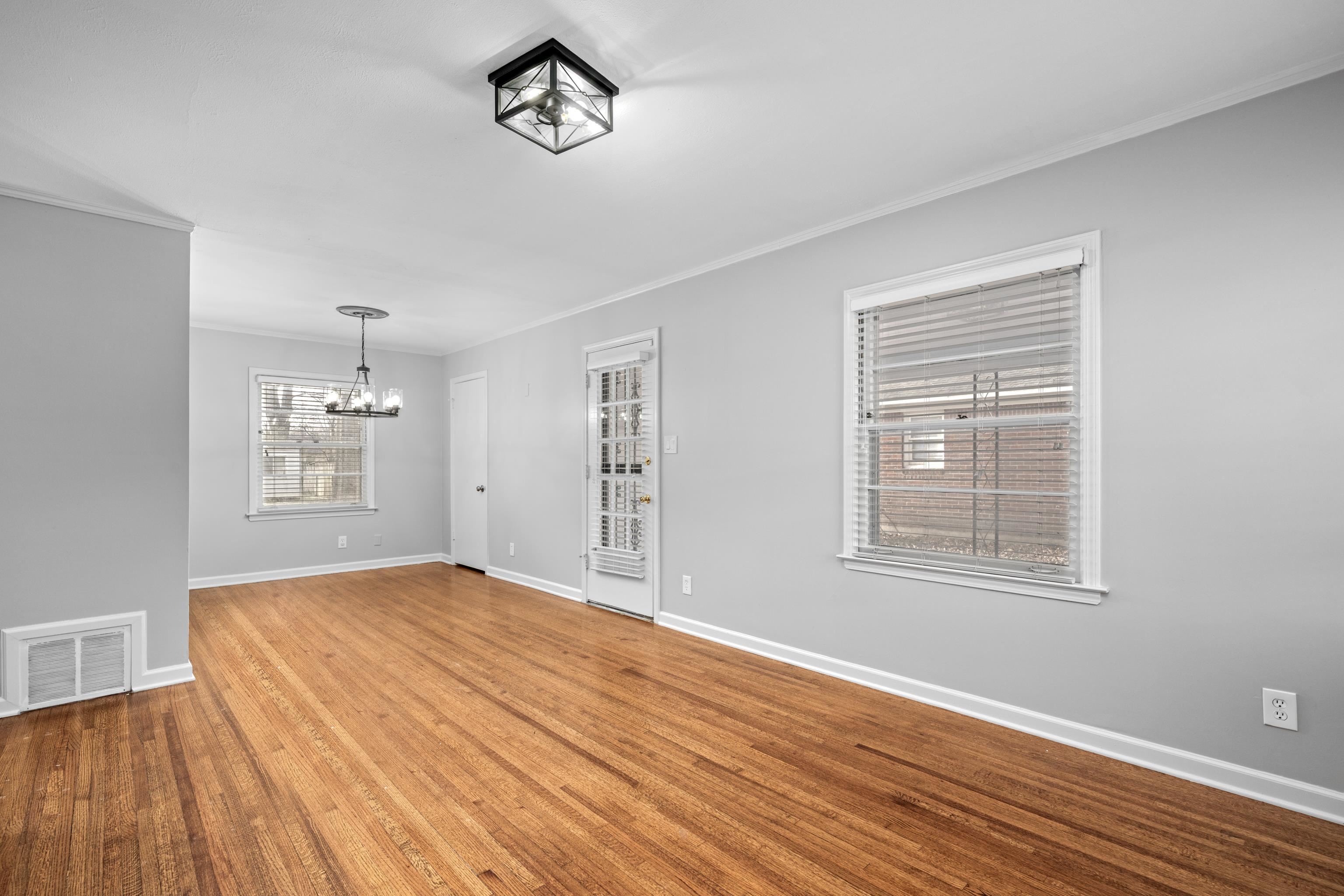 1453 Colonial Road Memphis, TN 38117 - Photo 6 of 36 a view of empty room with wooden floor and fan
