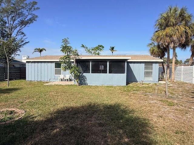 600 Russell Street Longboat Key, FL 34228 - Photo 12 of 13 a front view of a house with garden