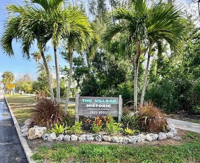 600 Russell Street Longboat Key, FL 34228 - Photo 13 of 13 a sign that is sitting in front of a tree