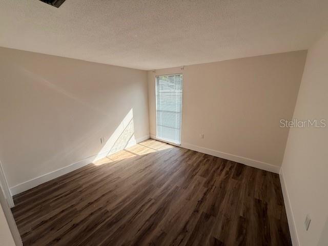 600 Russell Street Longboat Key, FL 34228 - Photo 9 of 13 a view of empty room with wooden floor