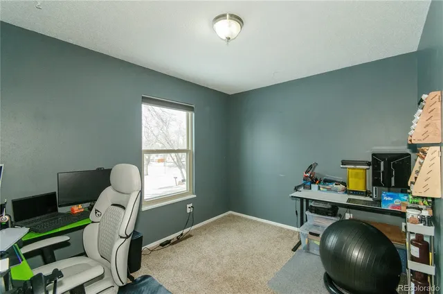 a workspace with furniture and a window