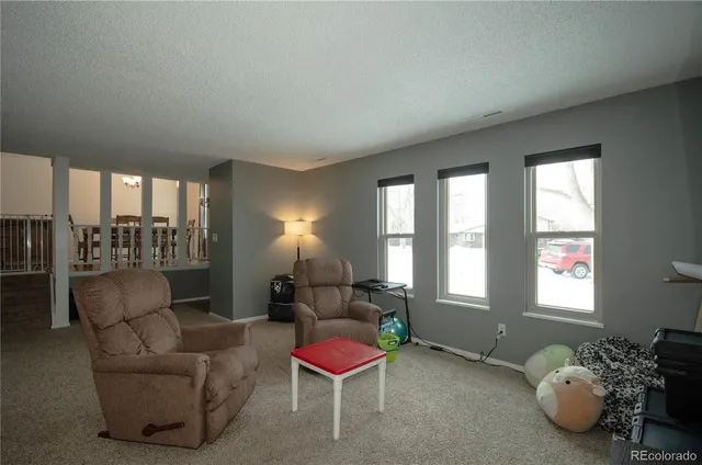 a living room with furniture and a table