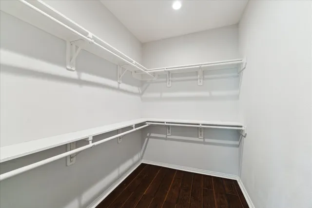 a view of storage and utility room with racks on the wall