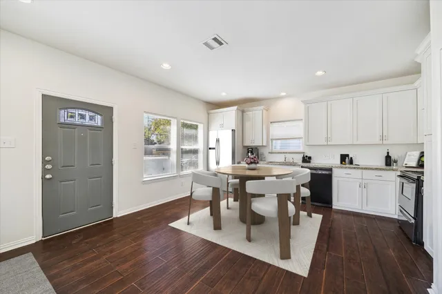 a view of kitchen with sink and wooden floor