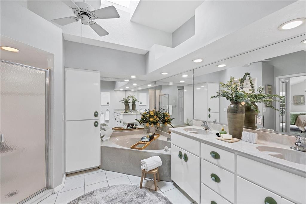 11 Amberjack Lane Placida, FL 33946 - Photo 12 of 46 a bathroom with a double vanity sink and a mirror