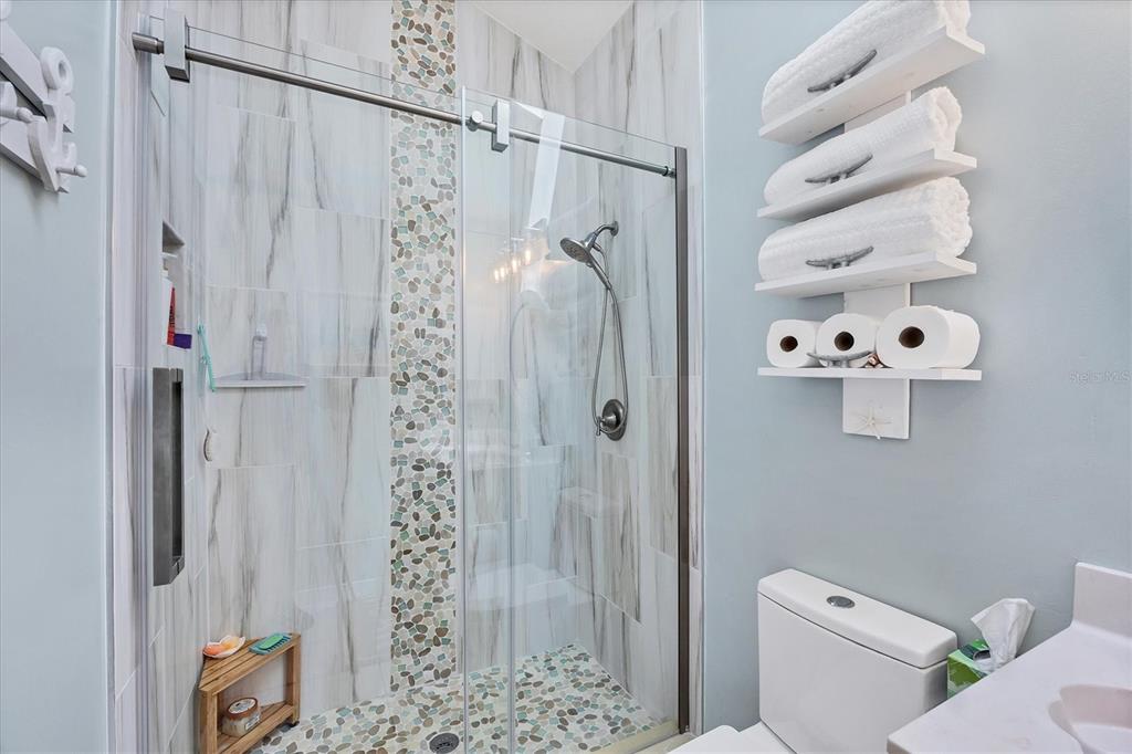 11 Amberjack Lane Placida, FL 33946 - Photo 15 of 46 a bathroom with a shower toilet and sink