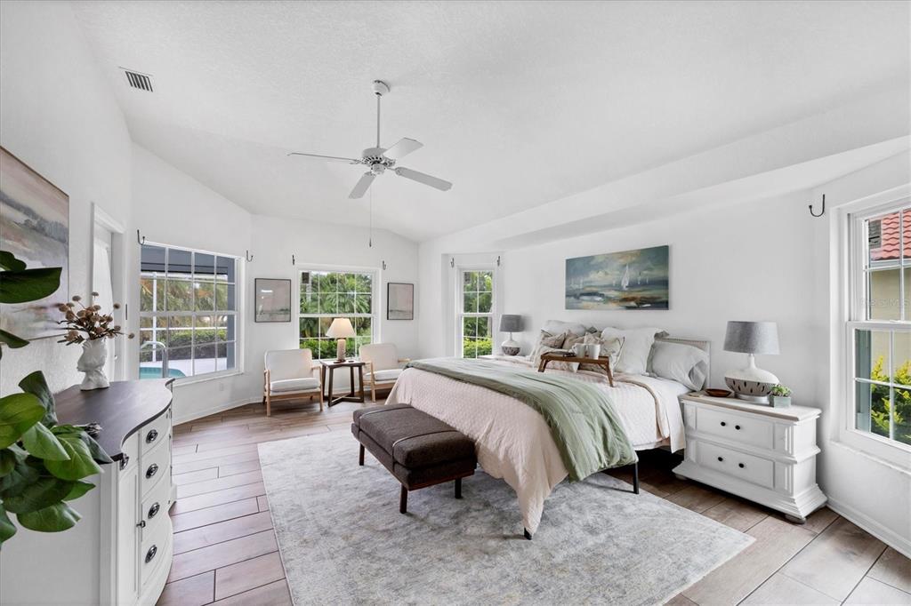 11 Amberjack Lane Placida, FL 33946 - Photo 20 of 46 a spacious bedroom with a bed and a couch