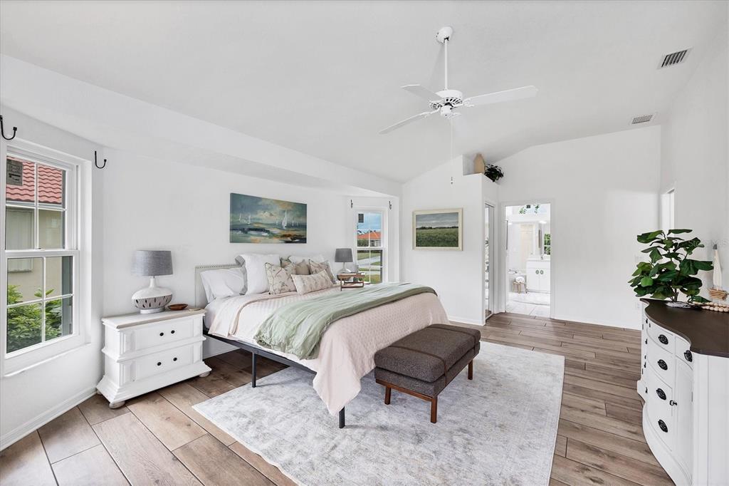 11 Amberjack Lane Placida, FL 33946 - Photo 22 of 46 a spacious bedroom with a bed and a couch