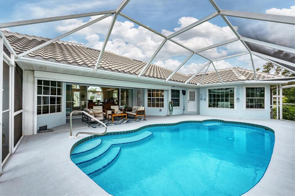 11 Amberjack Lane Placida, FL 33946 - Photo 24 of 46 a view of a house with swimming pool and sitting area