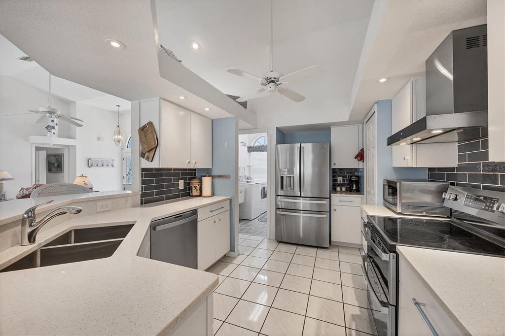 11 Amberjack Lane Placida, FL 33946 - Photo 29 of 46 a kitchen with a sink stainless steel appliances and cabinets