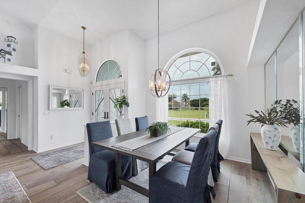 11 Amberjack Lane Placida, FL 33946 - Photo 32 of 46 a view of a dining room with furniture window and wooden floor
