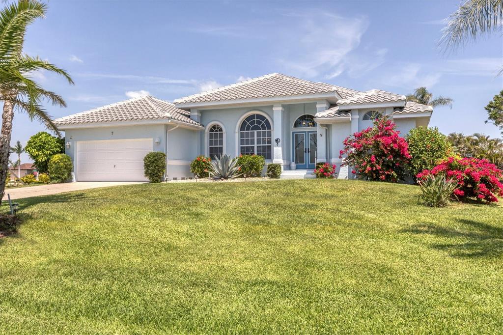 11 Amberjack Lane Placida, FL 33946 - Photo 42 of 46 a front view of a house with a garden