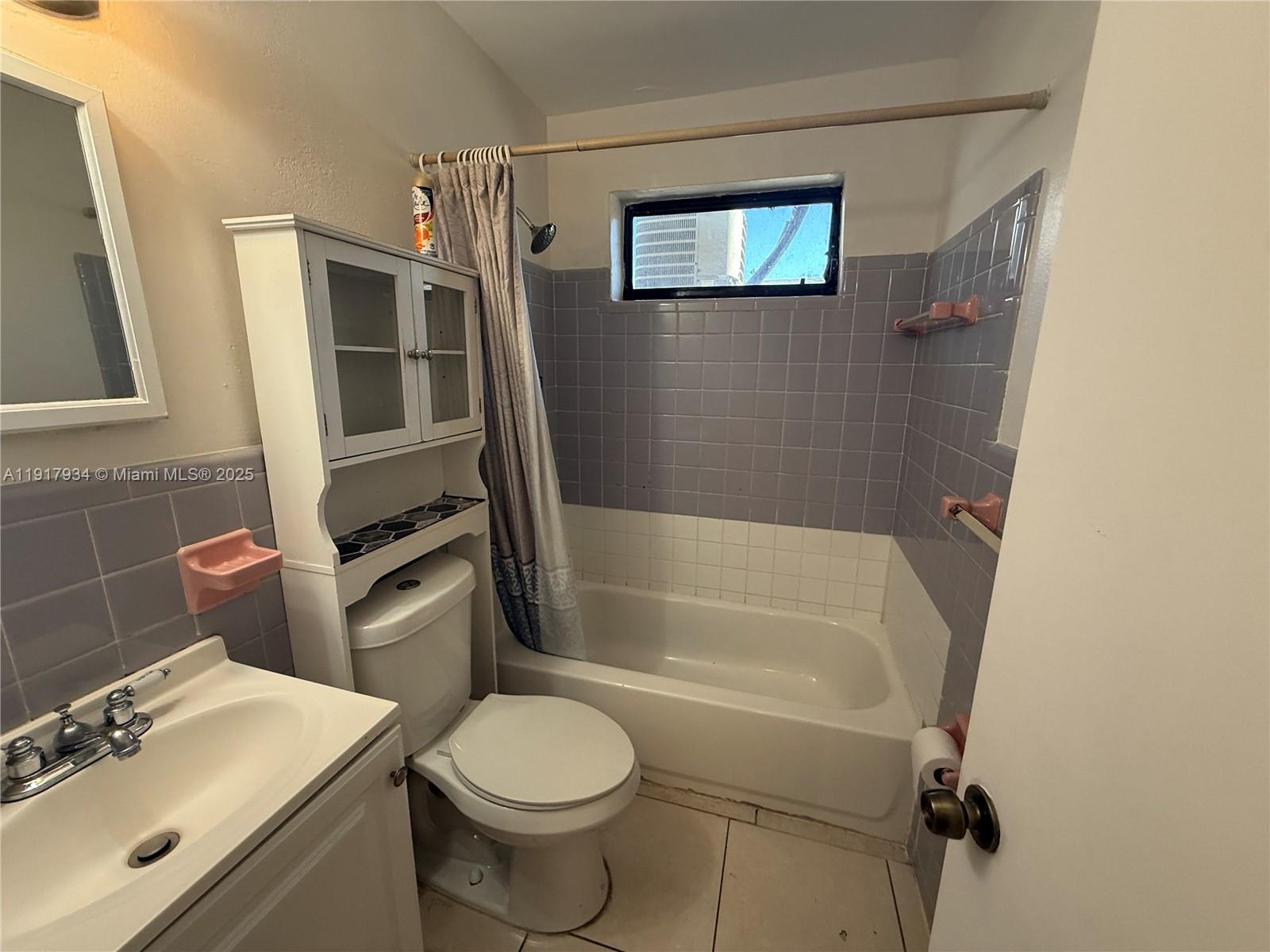 521 Southwest 9th Street, Unit 2 Hallandale Beach, FL 33009 - Photo 4 of 10 a bathroom with a sink toilet and shower