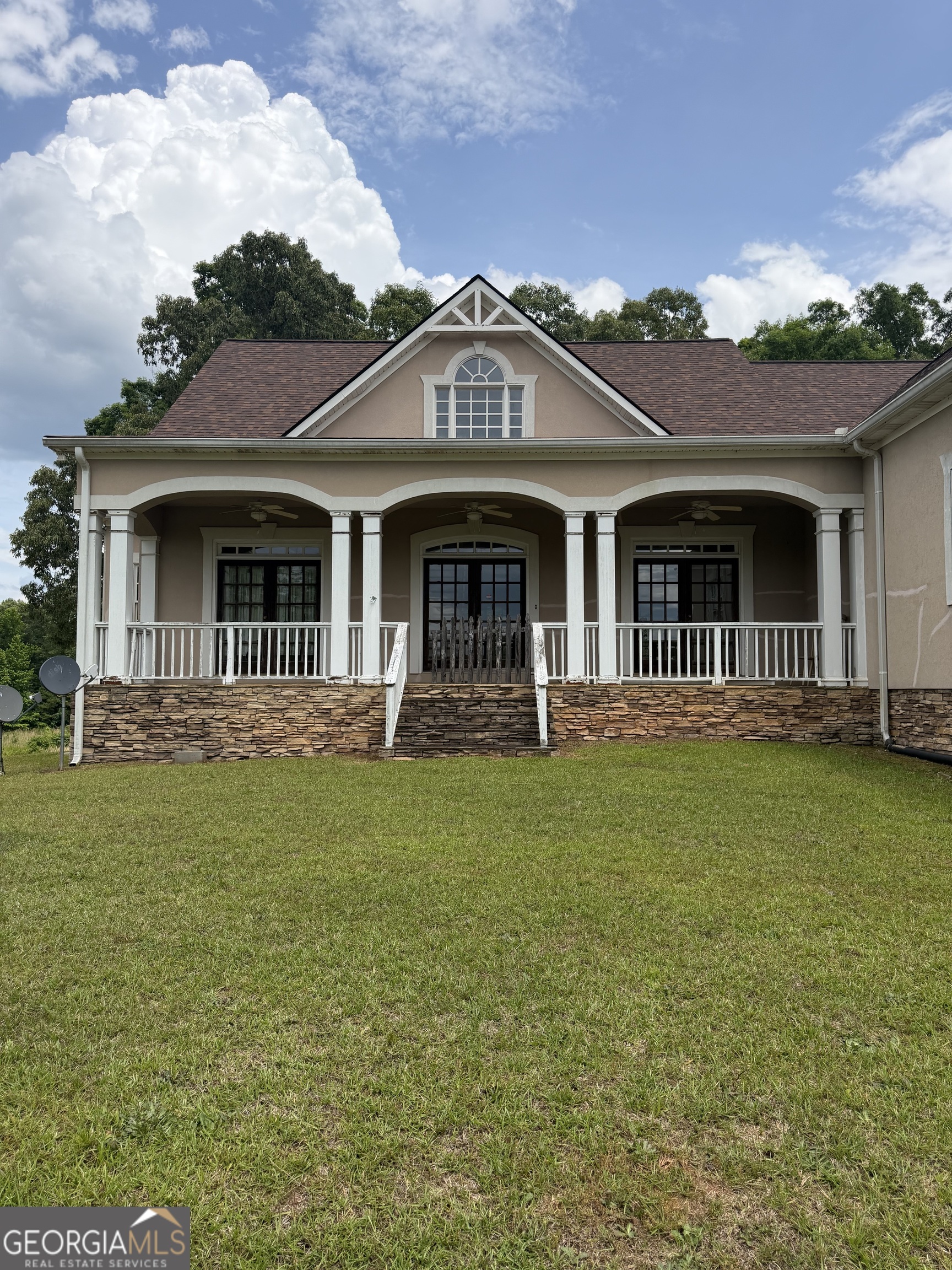 302 Norris Road Barnesville, GA 30204 - Photo 2 of 65 a front view of a house with garden