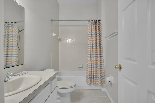 a view of a kitchen with wooden floor and a window