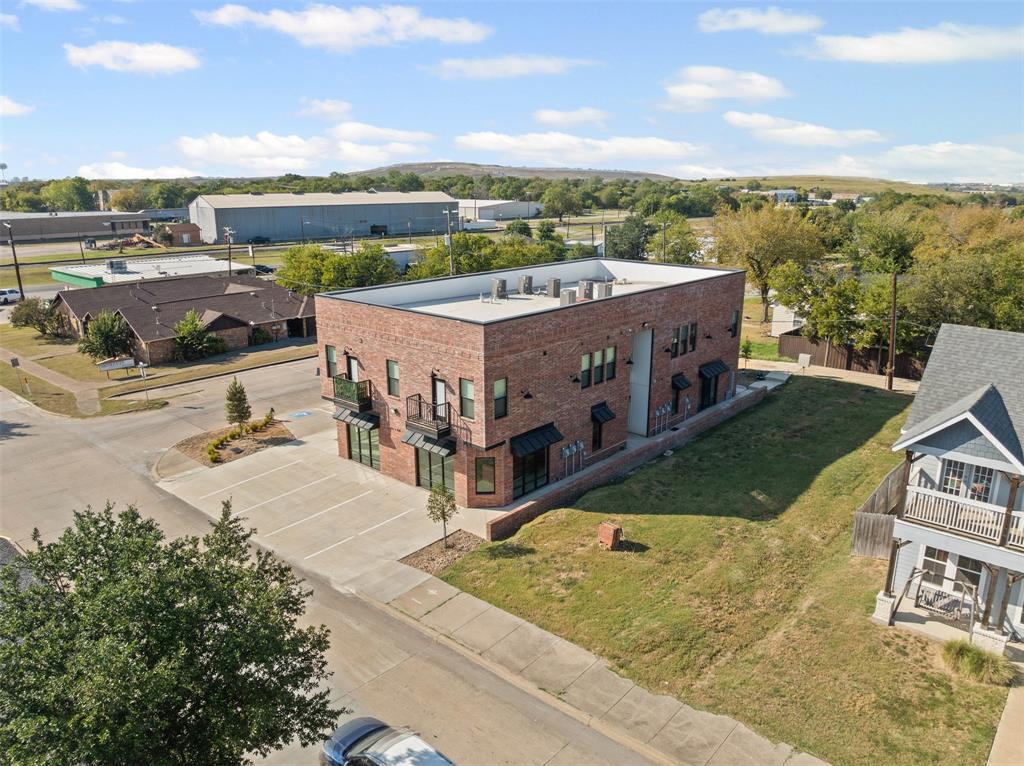 201 East 5th Street, Unit 201 Ferris, TX 75125 - Photo 3 of 19 a view of a terrace with yard