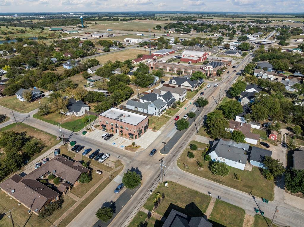201 East 5th Street, Unit 201 Ferris, TX 75125 - Photo 5 of 19 an aerial view of a city with lots of residential buildings