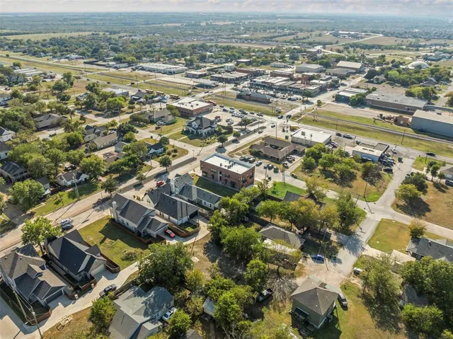 an aerial view of residential building with parking space