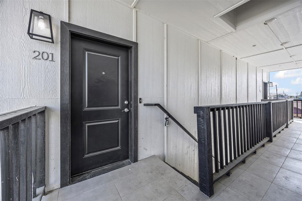 201 East 5th Street, Unit 201 Ferris, TX 75125 - Photo 10 of 19 a view of a hallway with entryway door