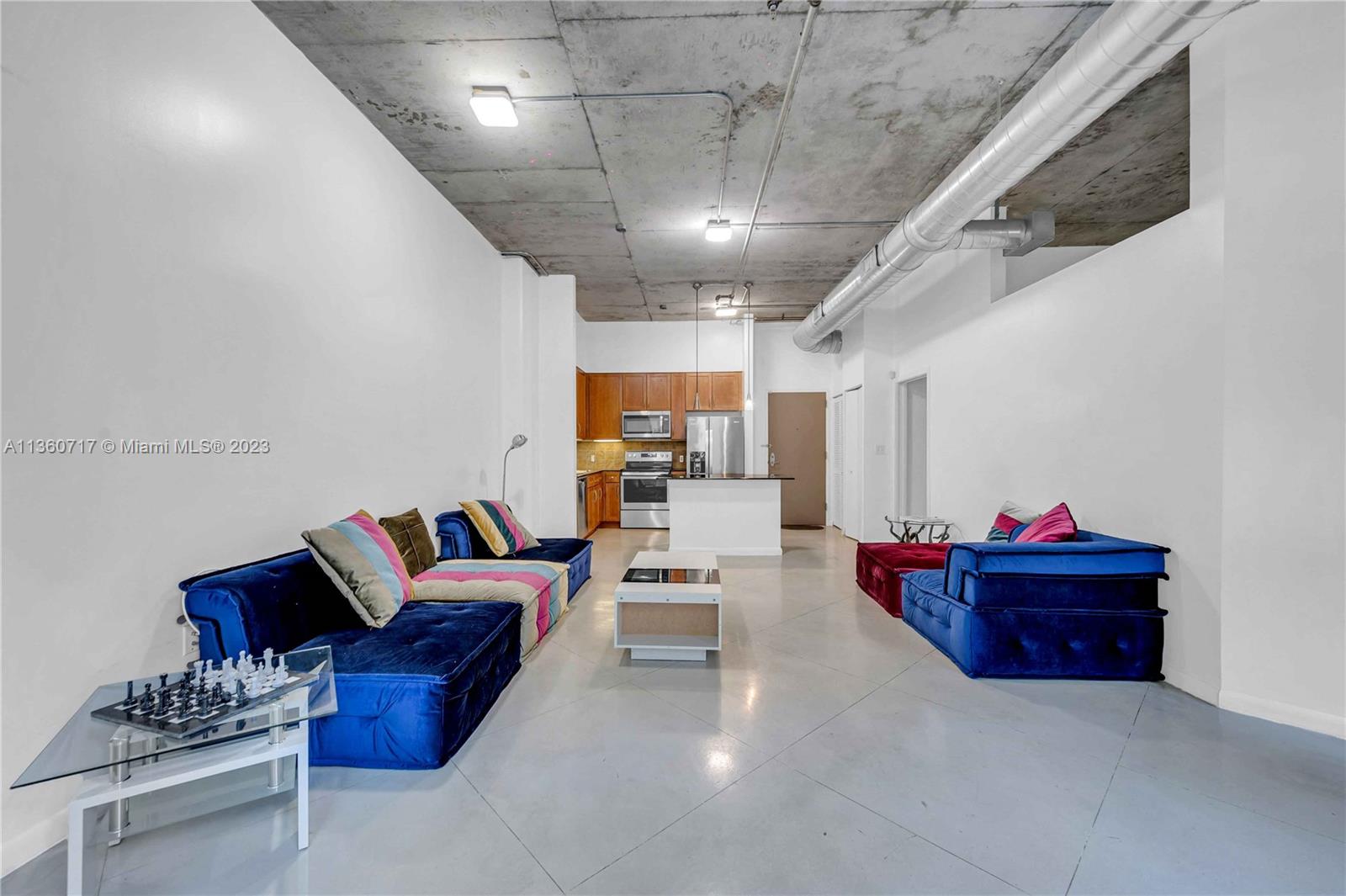 2001 Biscayne Boulevard, Unit 3207 Miami, FL 33137 - Photo 5 of 15 a living room with furniture and kitchen view