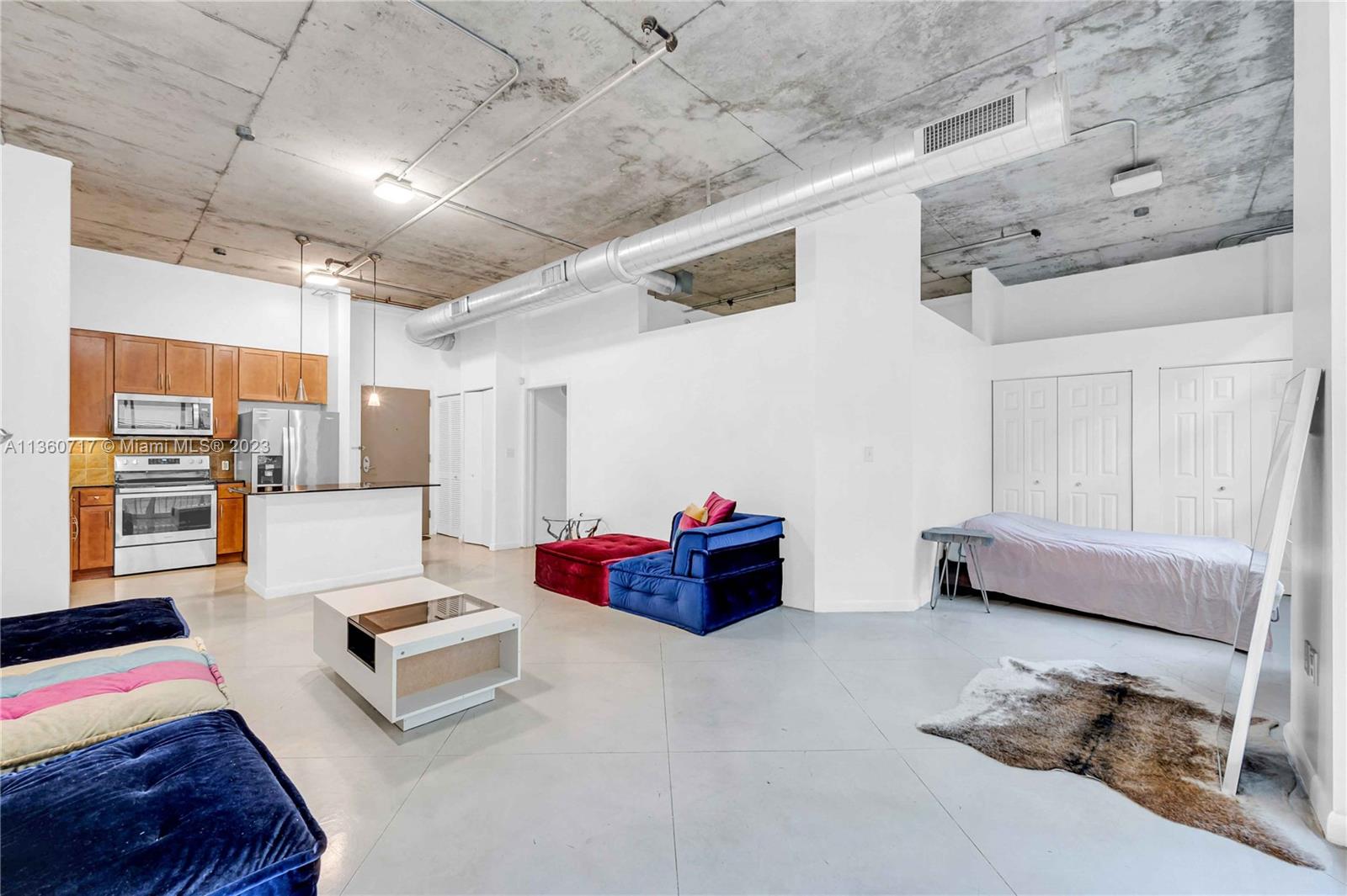 2001 Biscayne Boulevard, Unit 3207 Miami, FL 33137 - Photo 6 of 15 a living room with furniture and kitchen view