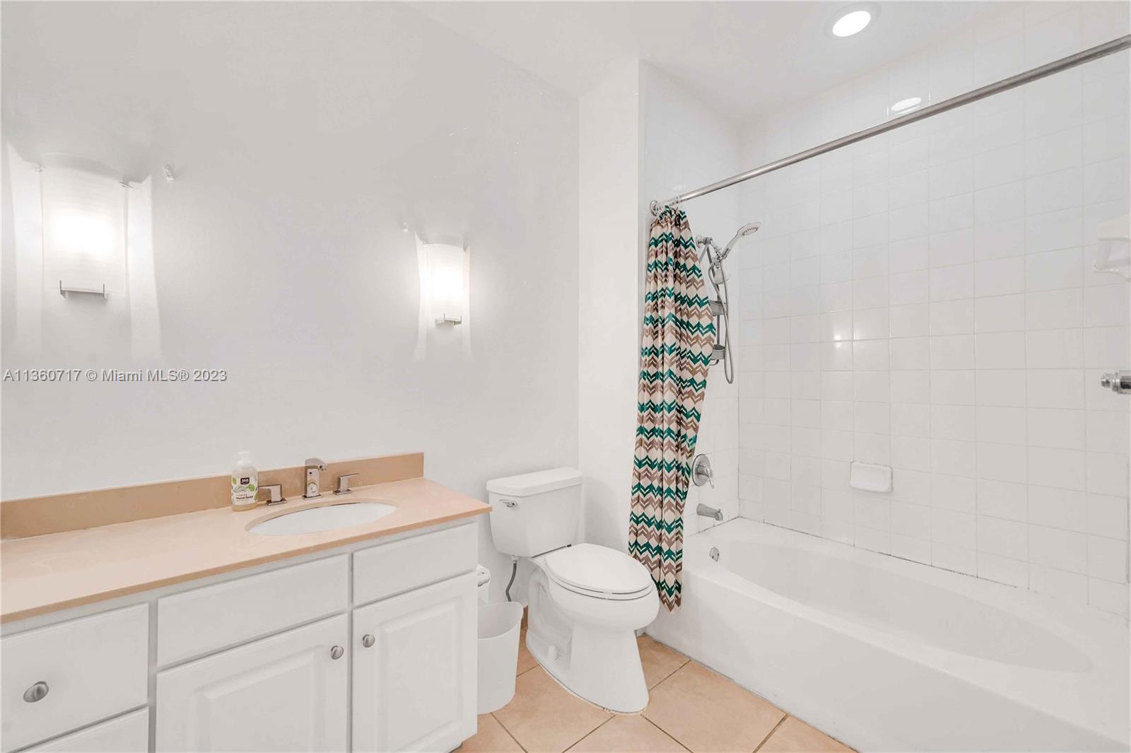 2001 Biscayne Boulevard, Unit 3207 Miami, FL 33137 - Photo 10 of 15 a bathroom with a sink a toilet and shower
