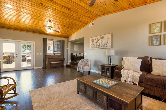 a living room with furniture and a table