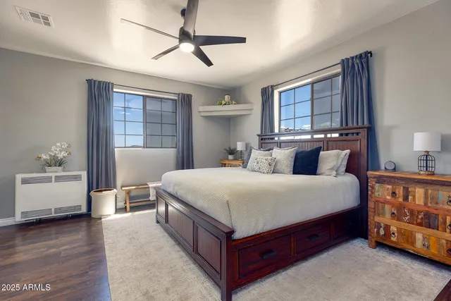 a bedroom with a large bed and a window