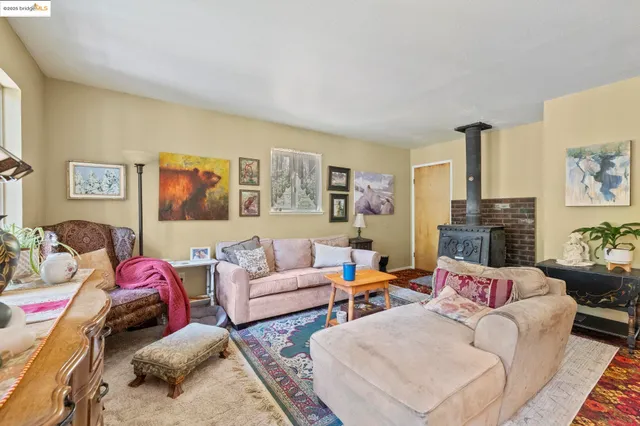 a living room with furniture fireplace and window