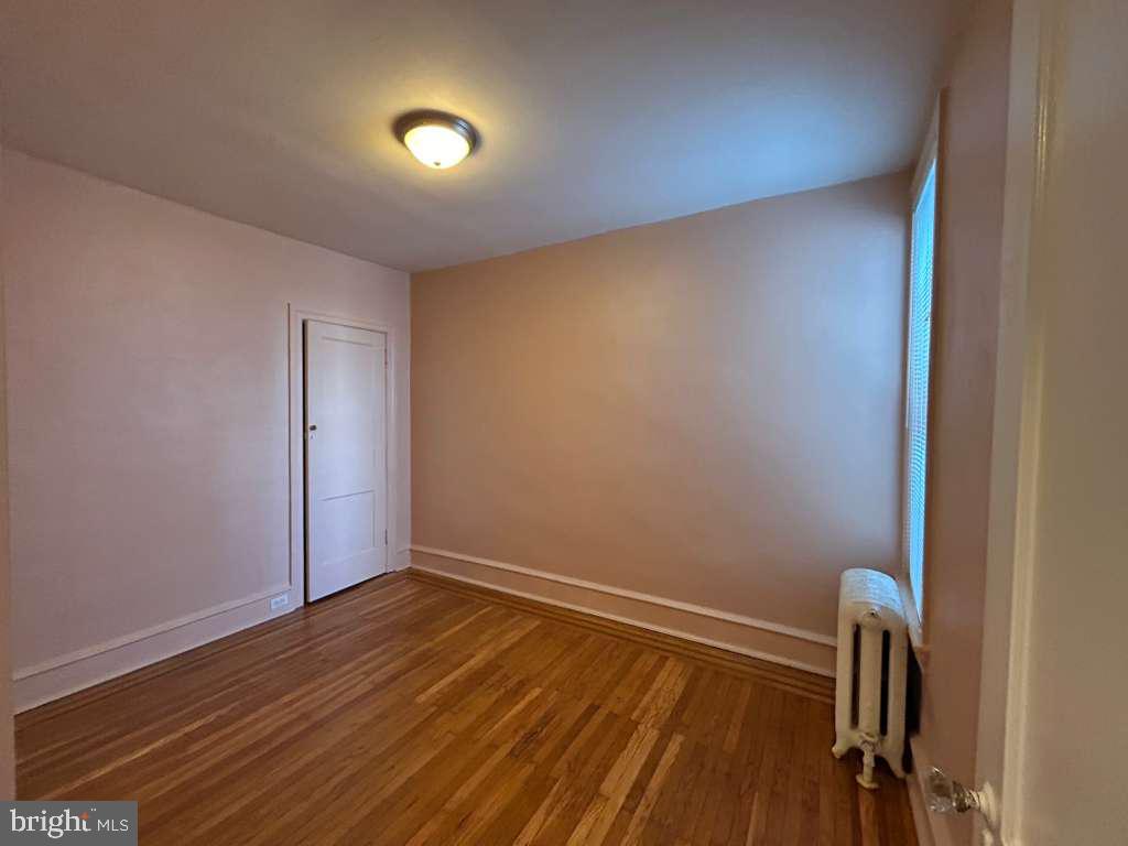 4747 Sansom Street Philadelphia, PA 19139 - Photo 19 of 21 a view of room with wooden floor