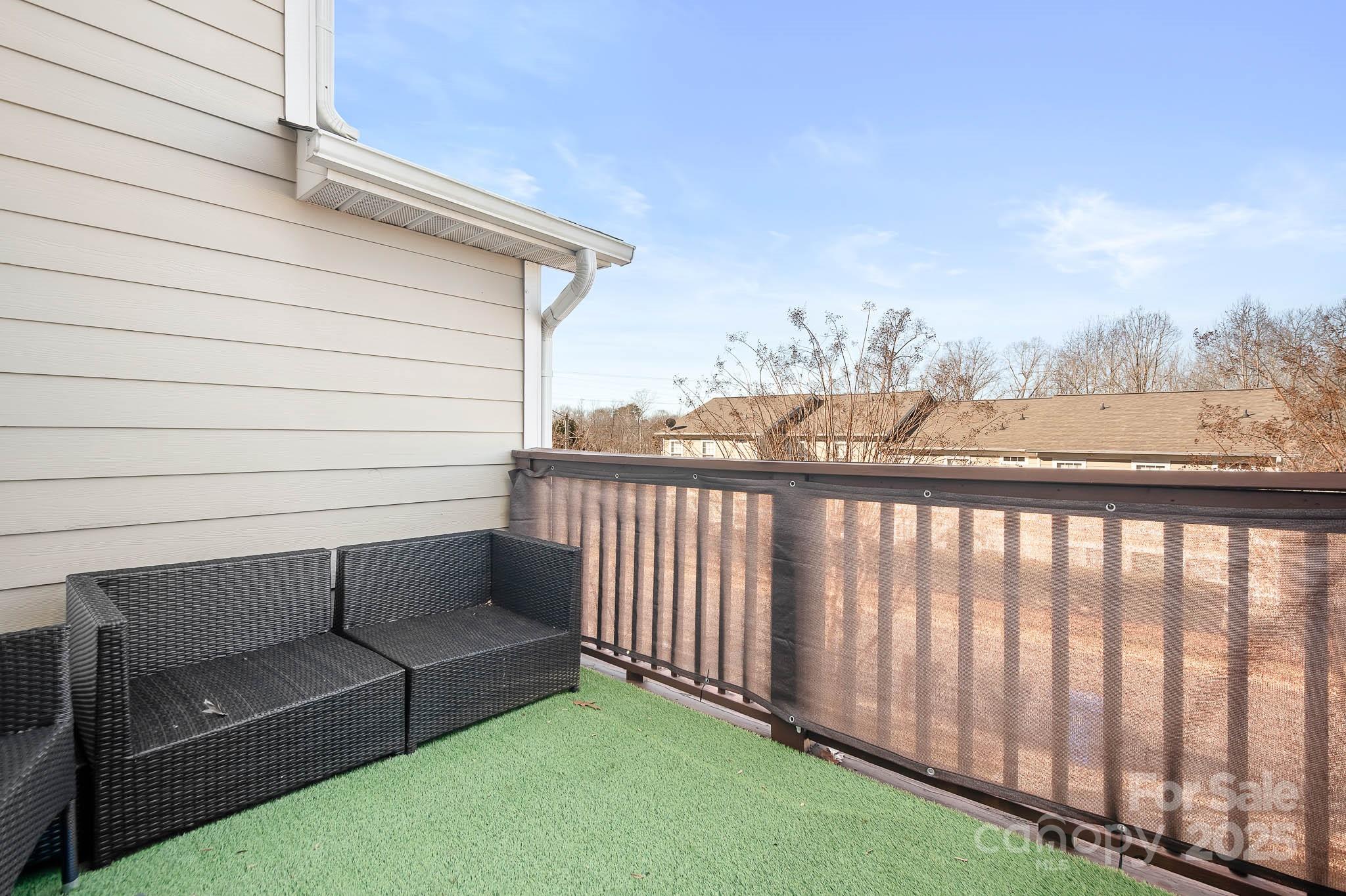 135 High Ridge Road Mooresville, NC 28117 - Photo 22 of 24 a view of a chair in the backyard