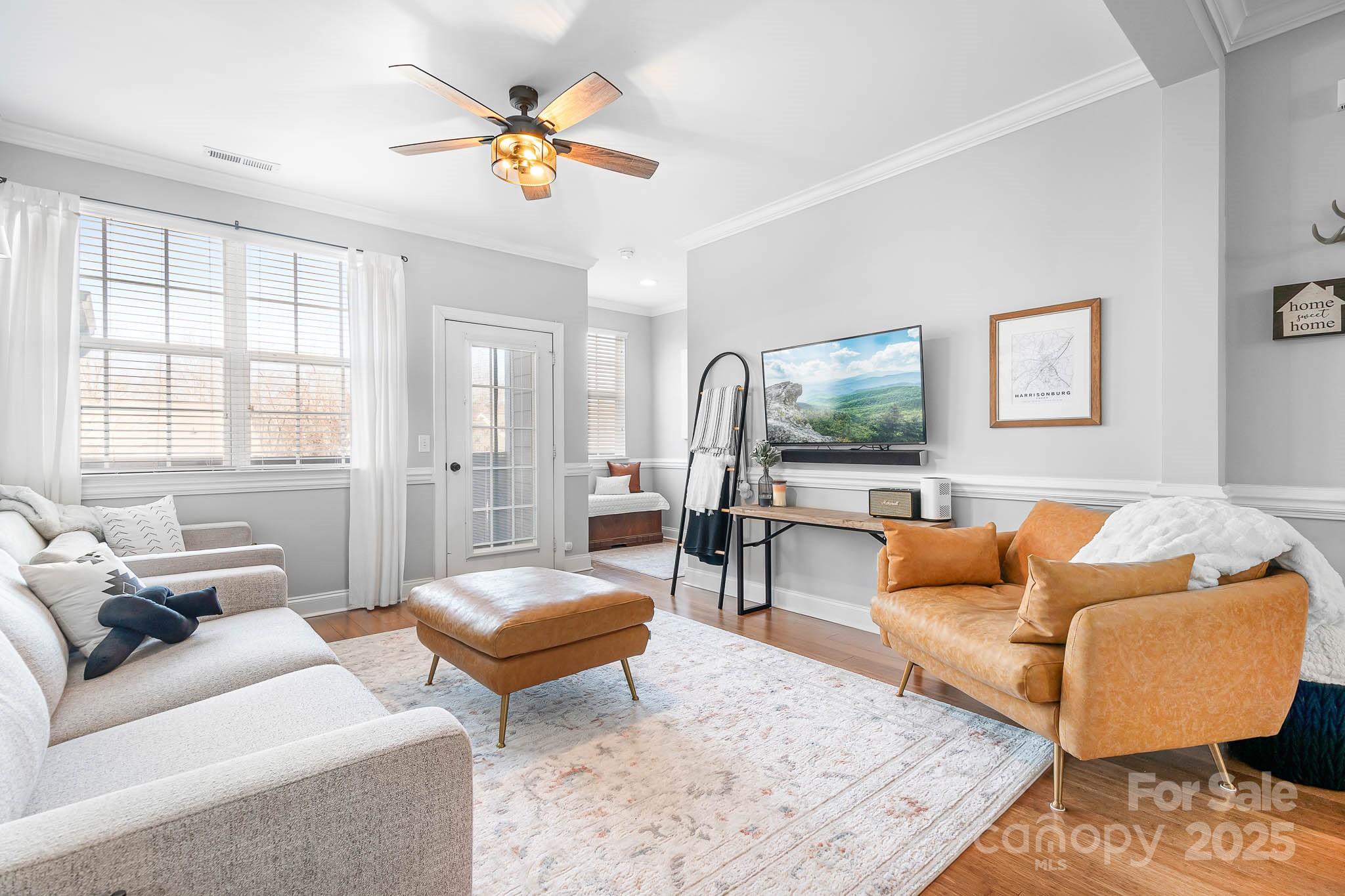 135 High Ridge Road Mooresville, NC 28117 - Photo 3 of 24 a living room with furniture a rug and a window